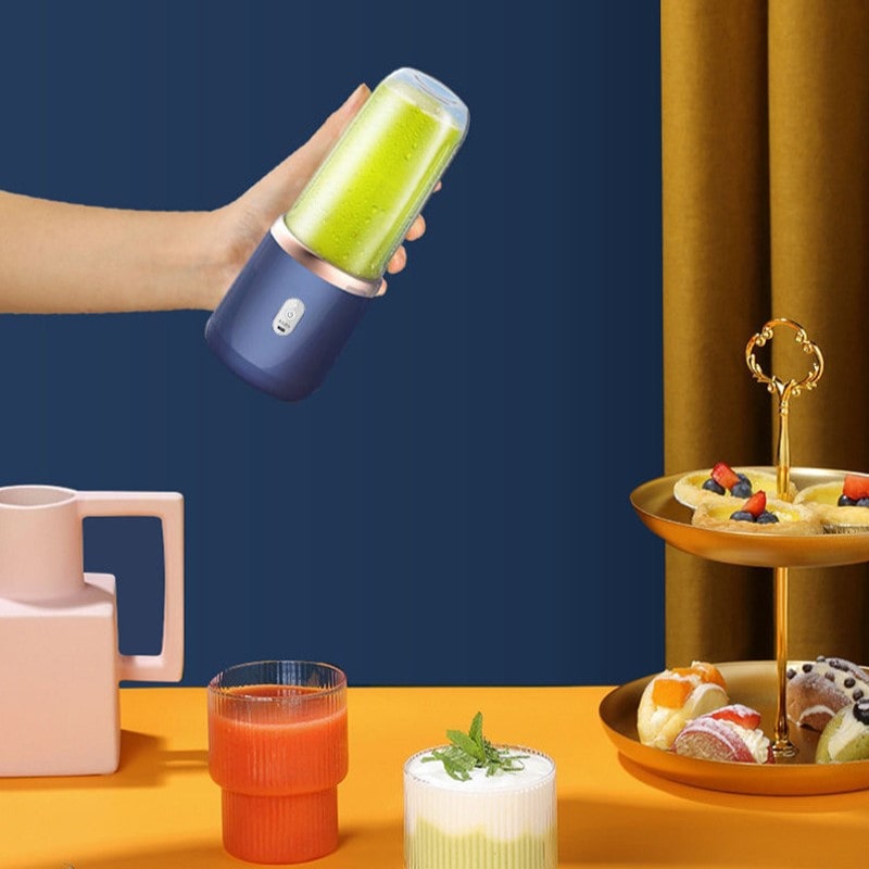 Bærbar elektrisk citruspresser med 6 blade - JuiceBoost™