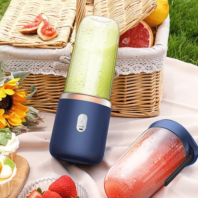 Bærbar elektrisk citruspresser med 6 blade - JuiceBoost™